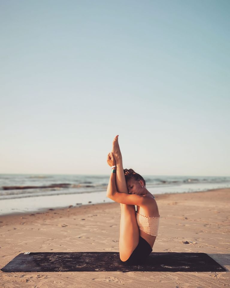 yoga mermaid pose beach